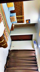 a staircase in a room with a bed and some stairs at 2bed available in Islamabad in Lower Topa