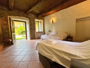 a bedroom with two beds in a room at Robin's Nest in Paruzzaro