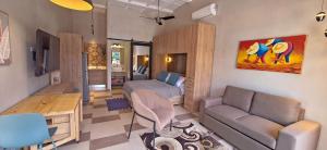 a living room with a bed and a couch at Club Heasa - Men Only in La Garita
