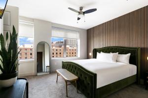 a bedroom with a large bed and a large window at California Building in New Orleans +253 photos