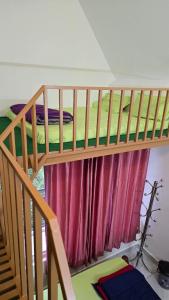 a bunk bed in a room with a window at Elora Homes in Vagamon