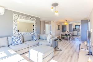 a living room with a couch and a table at Quayside 301 by CTHA in Cape Town