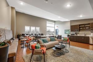 a living room with a couch and chairs at Trailside Haven @ Trailside45 in Traverse City