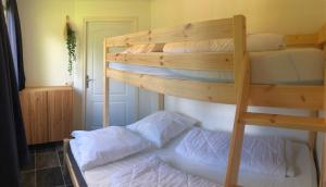 Ένα ή περισσότερα κρεβάτια σε δωμάτιο στο Chalet Selesa Beekbergen