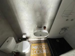 a small bathroom with a toilet and a sink at Your home in the Cape in Cape Town