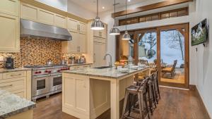 a kitchen with a large island with a counter top at Alpenzauber Lodge in Vail