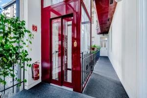 a red door on the side of a building at Elisabeth Old Town in Bratislava