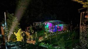 a house lit up at night with lights at Zakątek u Poety Dąbrówka in Jasło +71 photos