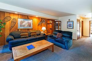 a living room with two couches and a coffee table at Horizons 4 - Pool & Hot Tub Access in Mammoth Lakes