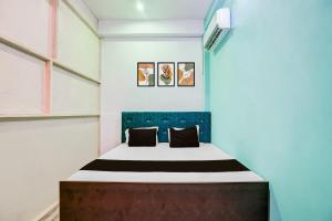 Hotel O Ayush Hotel & Restaurantにあるベッド