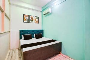 Ένα ή περισσότερα κρεβάτια σε δωμάτιο στο Hotel O Ayush Hotel & Restaurant