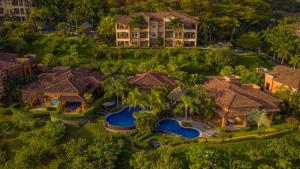 an aerial view of a house with a swimming pool at Marbella 3D 3 bdr Ocean View in Los Suenos in Herradura