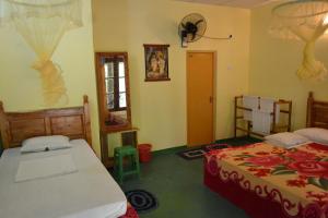 Postel nebo postele na pokoji v ubytování Sigiriya Freedom Lodge + 37 fotografií