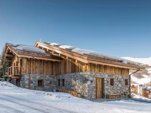 a building with snow on top of it at Chalet skis aux pieds avec bain nordique et hammam, 12-14 pers - FR-1-570-3 in Saint-Martin-de-Belleville
