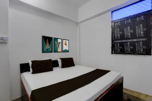 Ένα ή περισσότερα κρεβάτια σε δωμάτιο στο SPOT ON RED DIAMOND HOTEL & SWEET RESTAURANT