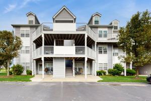 a large white house with balconies at Bethany Bay --- 30381 Crowley Drive Unit #318 in Ocean View
