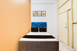 Ένα ή περισσότερα κρεβάτια σε δωμάτιο στο Hotel O Ayush Hotel & Restaurant