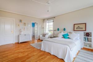 En eller flere senge i et værelse på Bahía del Amerador