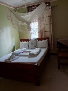 Postel nebo postele na pokoji v ubytování Gugga Resort Hotel