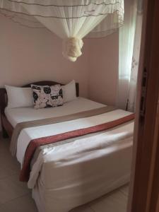 Postel nebo postele na pokoji v ubytování Gugga Resort Hotel + 9 fotografií