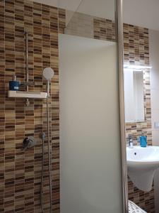a bathroom with a shower and a sink at Stella Maris - Private Apartment in Bari
