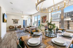 a dining room and living room with a dining table at California Building in New Orleans