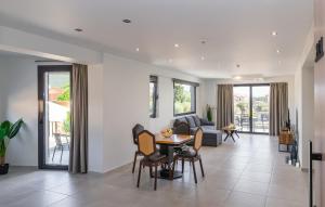 a living room with a table and chairs at arvangroup-apartments in Nafpaktos