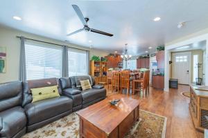 a living room with a couch and a table at Red River Retreat in Capital Hill