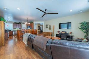 a living room with a couch and a dining room at Red River Retreat in Capital Hill