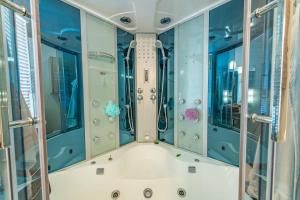a bathroom with a tub and a shower at Red River Retreat in Capital Hill +32 photos