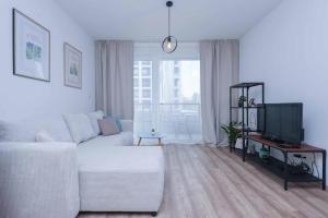 TV a/nebo společenská místnost v ubytování Urban Residence