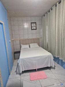 Ένα ή περισσότερα κρεβάτια σε δωμάτιο στο Pousada Top Mix 101