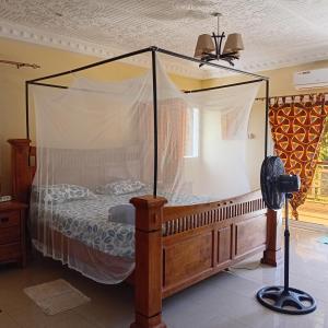 a bedroom with a bed with a canopy at Sen Keur in Somone +41 photos