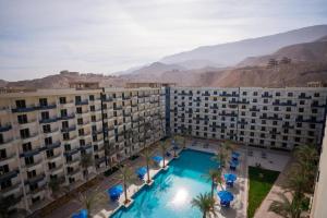 an aerial view of a hotel with a swimming pool at 207 , viva coast resort in Ain Sokhna