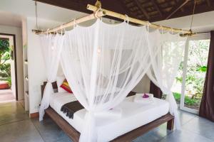 Koyao Bay Pavilions - Beach Resort and Pool Villas客房内的一张或多张床位