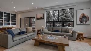 a living room with two couches and a coffee table at Chalet Bello in Beaver Creek