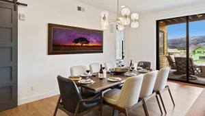 a dining room with a table and chairs at Chalet Breton in Steamboat Springs