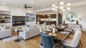a dining room and living room with a table and chairs at Chalet Breton in Steamboat Springs