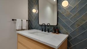 a bathroom with a white sink and a mirror at Chalet Bello in Beaver Creek