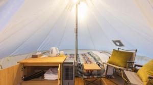 a tent with a bed and a desk in it at SPRINGS VILLAGE Ashigara Tanzawa Onsen Resort & Gl - Vacation STAY 41909v in Hata