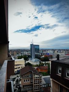 a view of a city with buildings and a sky at Prishtina Sky View in Prishtinë