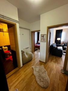 a living room with a couch and a living room with at Prishtina Sky View in Prishtinë