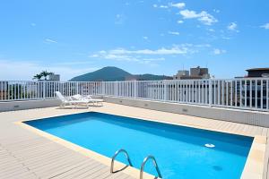 Bazén v ubytování Condomínio Portinari nebo v jeho okolí