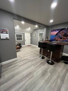 a living room with a desk and a piano at Walk to Downtown | Workspace + Pet Friendly in Pleasanton