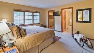 a bedroom with a large bed and a television at Chalet Fairway in Beaver Creek