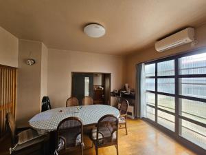 a dining room with a table and chairs at Mogamigun - House - Vacation STAY 20213 in Shinjo