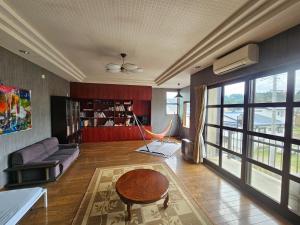 a living room with a couch and a table at Mogamigun - House - Vacation STAY 20251 in Shinjo