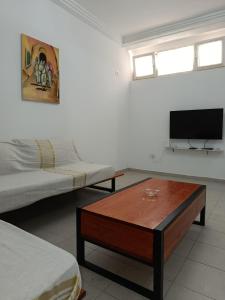 a living room with a bed and a coffee table at Paradis mira in La Marsa +14 photos