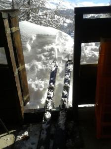 a view of a snow covered window of a house at Studio Vars in Collobrières