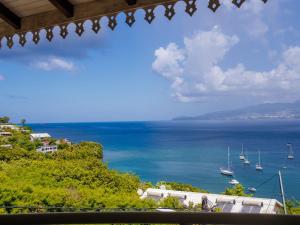 a view of the ocean from a house at Ocalie, Charme et Plage à Deux Pas in Les Trois-Îlets